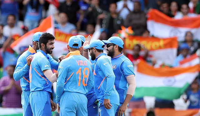India’s Jasprit Bumrah, left, celebrates with teammates the dismissal of Sri Lanka’s Kusal Perera during the Cricket World Cup match between India and Sri Lanka at Headingley.