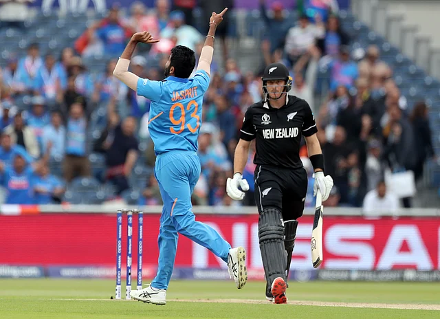 India’s Jasprit Bumrah, left, celebrates the dismissal of New Zealand’s Martin Guptill, right, during the Cricket World Cup semi-final match between India and New Zealand.