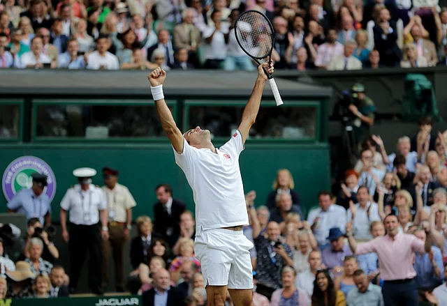 Roger Federer celebrates defeating Spain’s Rafael Nadal.