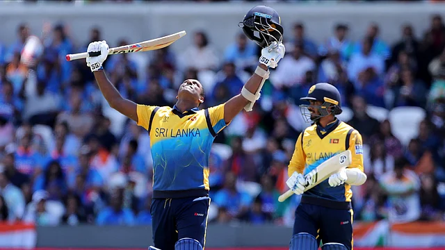 Sri Lanka’s Angelo Mathews, left, celebrates scoring a century during the Cricket World Cup match between India and Sri Lanka at Headingley in Leeds, England