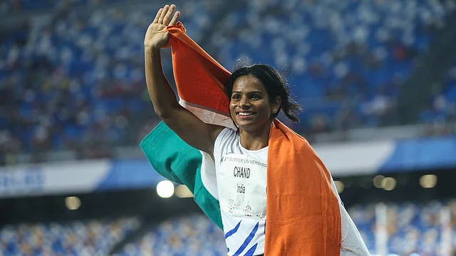 Dutee Chand celebrates her victory after the Women’s 100m Final at the 30th Summer Universiade in Naples.