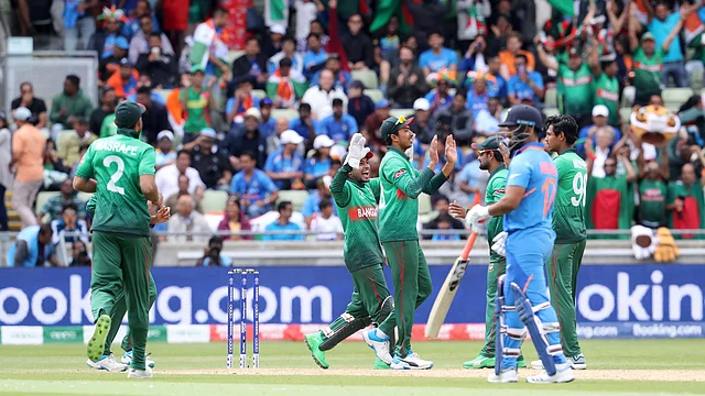 Bangladeshi cricketers celebrate the dismissal of India’s Hardik Pandya during the Cricket World Cup match between India and Bangladesh.