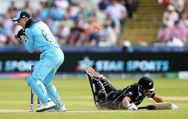 New Zealand’s Ross Taylor is run out by England’s Jos Buttler during the Cricket World Cup match between New Zealand and England.