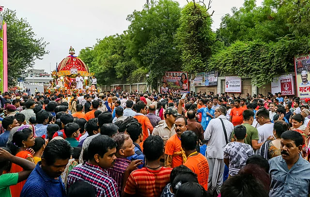 Devotees pull the chariot of Lord Jagannath during the Rath Yatra, in New Delhi, Thursday.