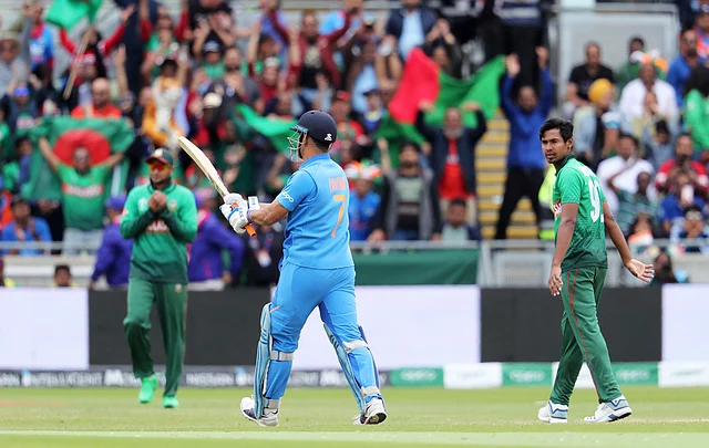 India’s Mahendra Singh Dhoni leaves the field after being dismissed during the Cricket World Cup match between India and Bangladesh at Edgbaston.