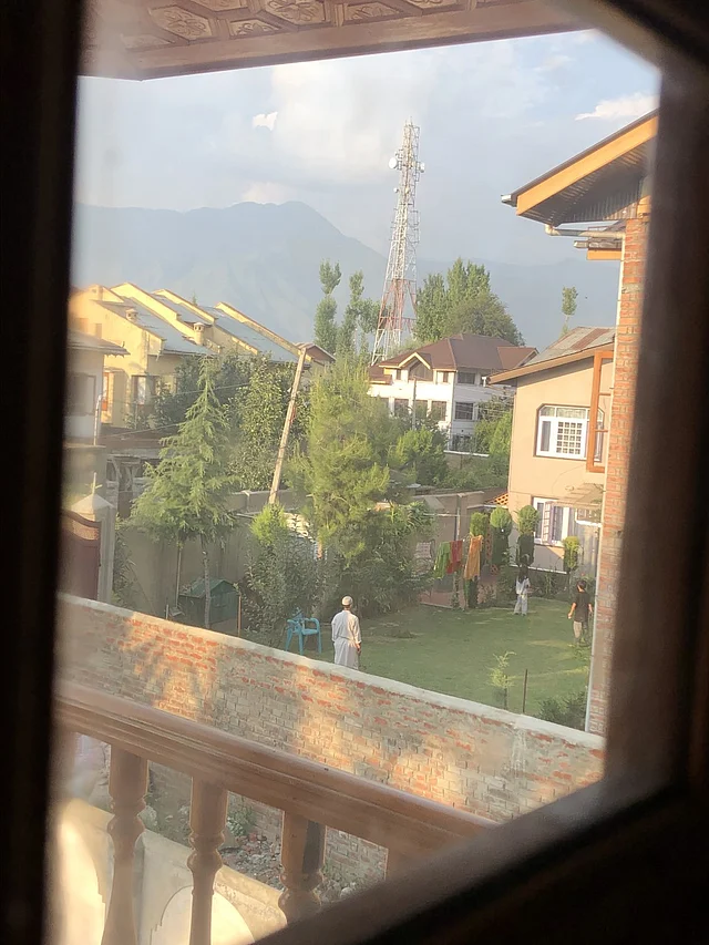 The neighbours’ kids playing with their grandfather on 5 August, oblivious of the news.