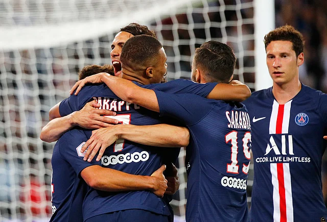 PSG’s Kylian Mbappe, third from left, celebrates after scoring his side’s second goal during the French League One soccer match between Paris Saint Germain and Nimes at the Parc des Princes Stadium in Paris, Sunday, Aug. 11, 2019.