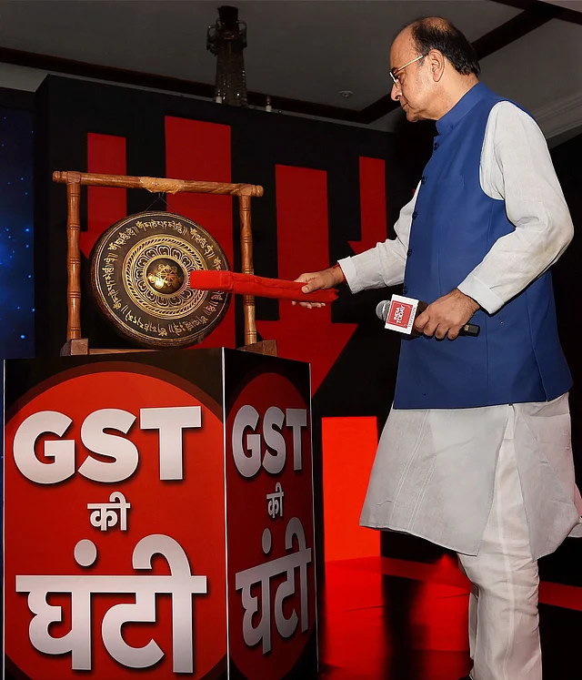 In this 30 June 2017 file photo, then Finance Minister Arun Jaitley hits the GST Bell at India Today’s Conclave on GST, in New Delhi.