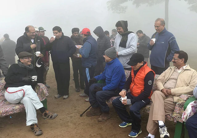 In this 28 December 2014 file photo, then Union Finance Minister Arun Jaitley is having a cup of tea with morning walkers on his 62nd birthday at the Lodhi Garden in New Delhi.