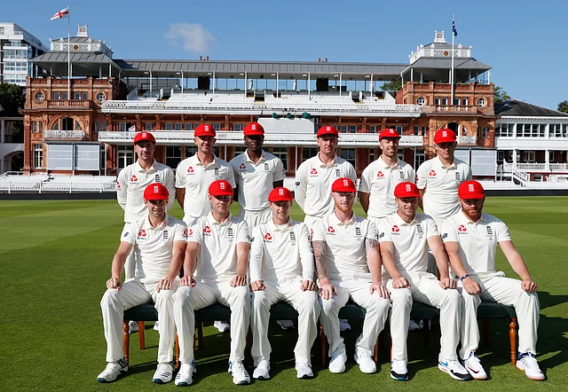 England cricket team pose for a team photo in front of the Lord’s pavilion wearing red caps which will be worn on day two of the second Test.