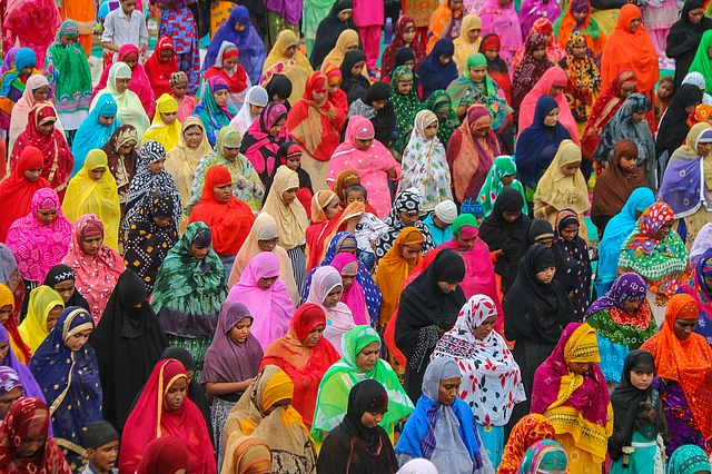 Muslim women offer prayers at a mosque on the eve of the Eid al-Adha festival on the outskirts of Ahmedabad, Sunday.