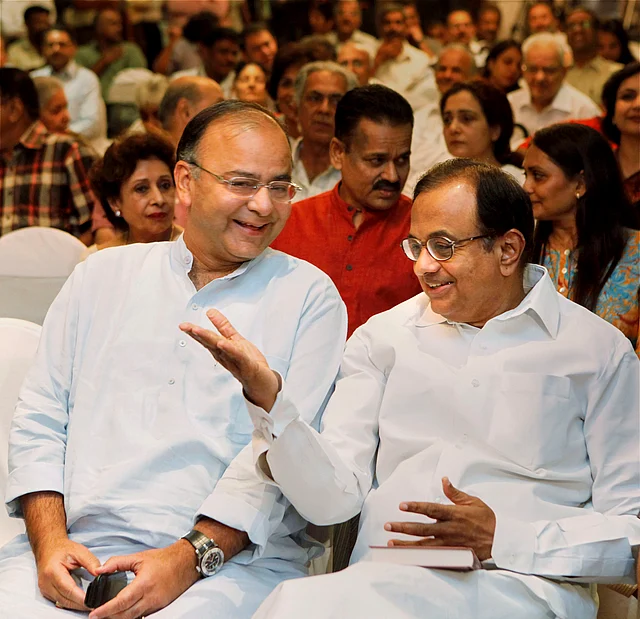 In this 3 August 2011 file photo, then Union Home Minister P Chidambaram and senior BJP leader Arun Jaitley are at the release of the book ‘Indian Mujahideen’, authored by Shishir Gupta, in New Delhi.