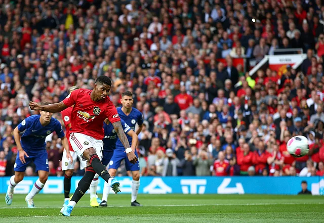 Manchester United’s Marcus Rashford shoots a penalty kick to score his sides first goal during the English Premier League soccer match between Manchester United and Chelsea at Old Trafford in Manchester, England, Sunday, Aug. 11, 2019. 