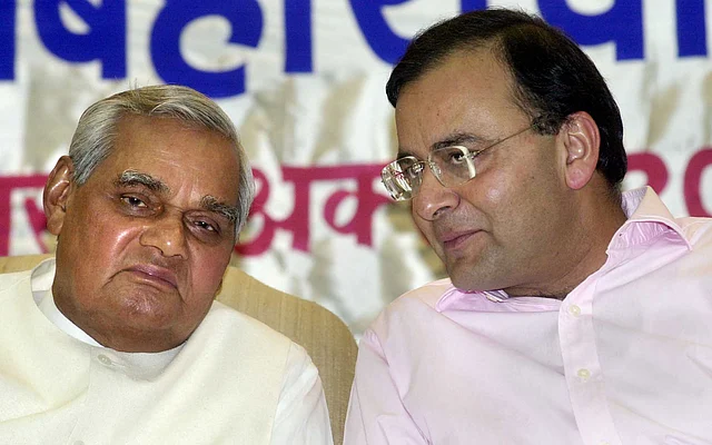 In this 12 October 2001 file photo, then Prime Minister Atal Bihari Vajpayee is having a conversation with then Union Law Minister Arun Jaitley, in New Delhi.
