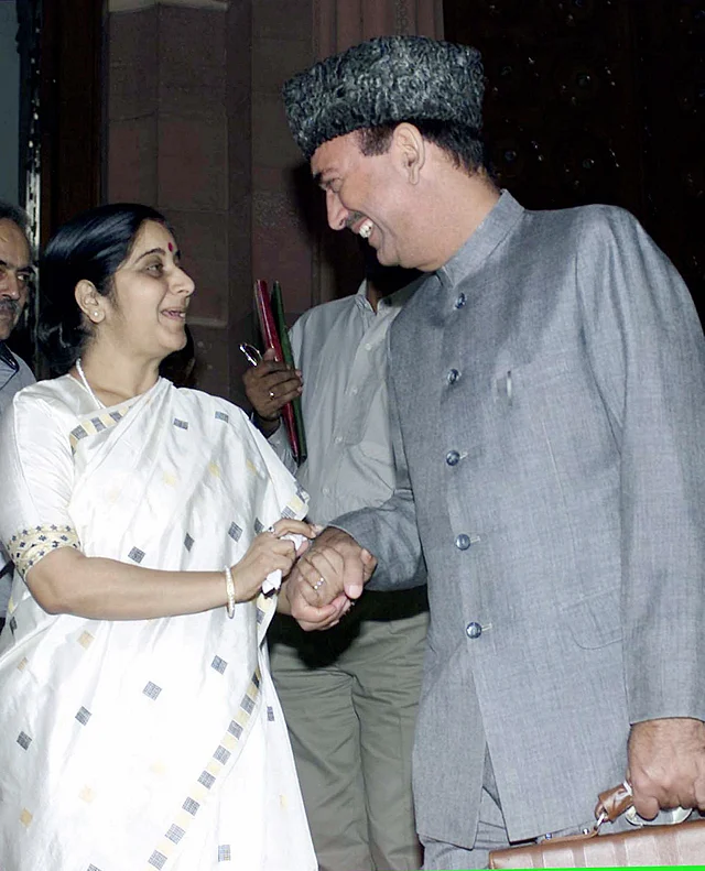 Then-information and broadcasting minister Sushma Swaraj with senior Congress leader Ghulam Nabi Azad at a Parliament House in New Delhi on 18 November 2002.