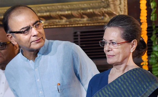 This 2 October 2015 file photo shows Congress President Sonia Gandhi and Union Finance Minister Arun Jaitley after paying tribute to former Prime Minister Lal Bahadur Shastri and Mahatma Gandhi on their birth anniversary at Parliament House, in New Delhi.