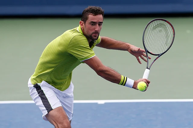Marin Cilic, of Croatia, returns a backhand against Radu Albot, of Moldova, during first round play at the Western & Southern Open tennis tournament, Monday, Aug. 12, 2019, in Mason, Ohio.