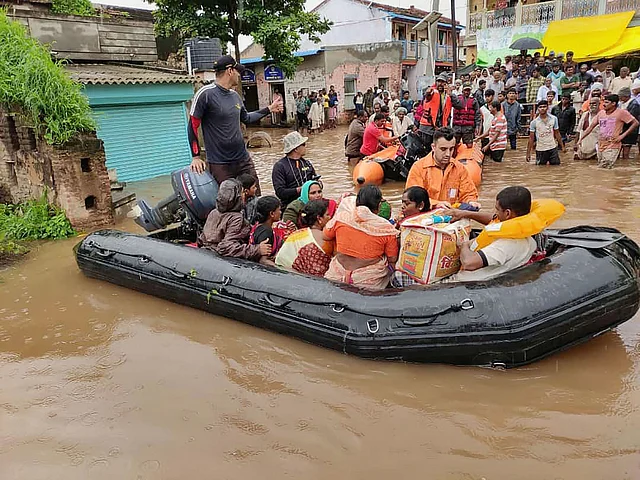 Indian Navy personnel rescue residents from flood-hit areas, in Sangli and Kolhapur districts of Maharashtra on 10 August 2019.