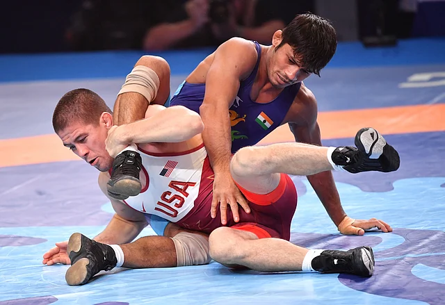 Rahul Balasaheb Aware, of India, right, and Tyler Lee Graff, of USA, compete at the bronze match of the men’s 61 kg category during the Wrestling World Championships in Nur-Sultan, Kazakhstan, Sunday, Sept. 22, 2019.