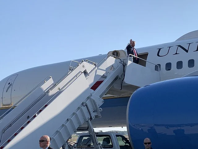 Donald Trump embarks on the Air Force One for a flight to Houston.