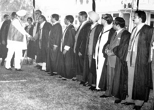 During Founder’s Day celebrations, Senior Master, Mr. Y. P. Johri, introduces the chief guest. Mr. Ram Singh is second from right, clasping his hands together over his belly.