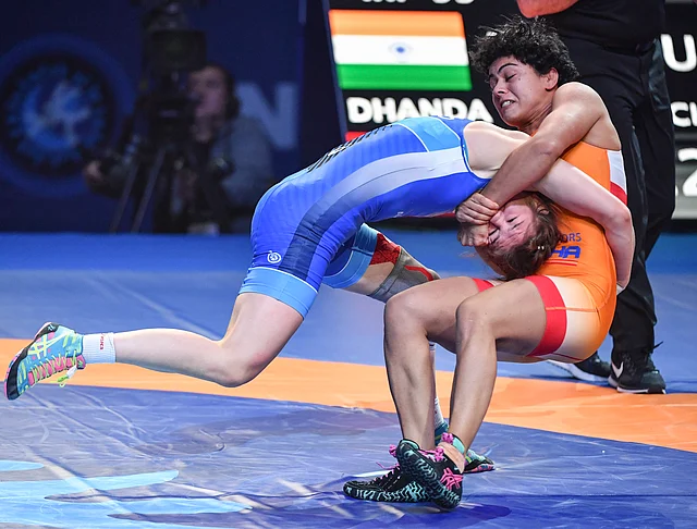 Pooja Dhanda of India, right, and Liubov Ovcharova of Russia compete at the semifinal of the women’s 59kg category during the Wrestling World Championships in Nur-Sultan, Kazakhstan, Wednesday, Sept. 18, 2019. 
