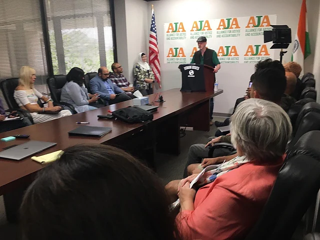 Pieter Friedrich addresses press conference. 