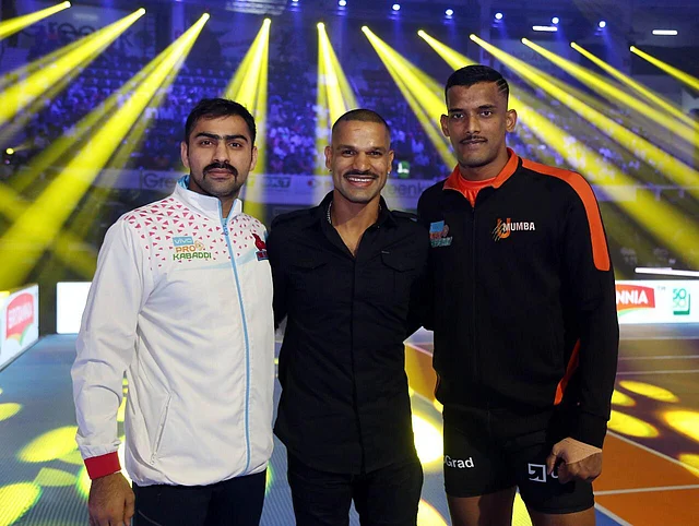 Cricketer Shikhar Dhawan and Kabaddi players Mohit Chillar and Siddharth Desai show off their mooch at the Pro Kabaddi League last year.