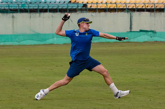 South African player Anrich Nortje throws a ball during a practice session at the Himachal Pradesh Cricket Association cricket stadium in Dharamsala.