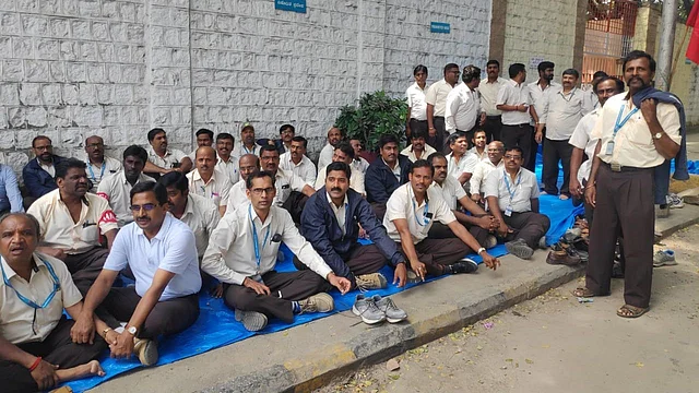 HAL workers stay away from work, protesting outside their division in Bengaluru on 14 October.