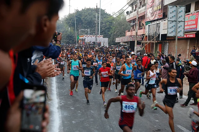 Participants run a marathon, held to mark the birth anniversary of former Indian Prime Minister Indira Gandhi, in Prayagraj on Tuesday.