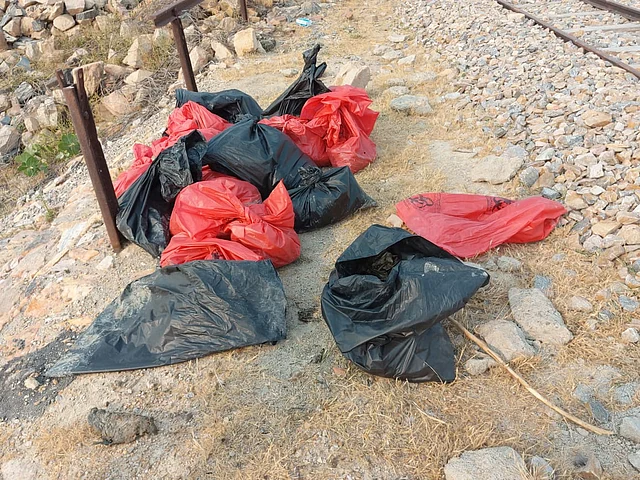 The rescue officials kept dead birds in the polythene bags.