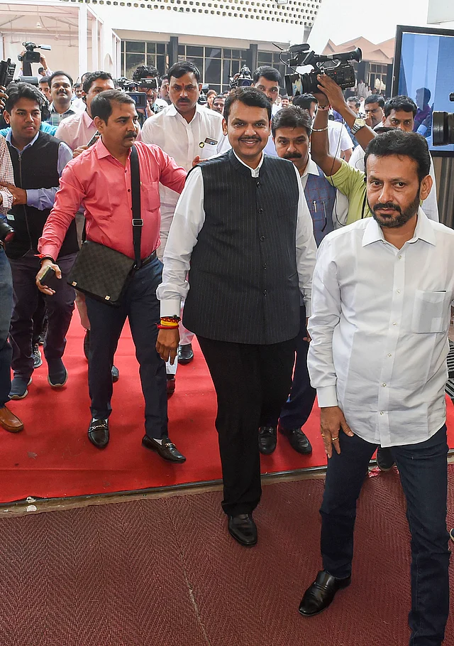 Former Maharashtra CM Devendra Fadnavis with BJP MLAs at Maharashtra Assembly, in Mumbai, Wednesday, Nov. 27, 2019. 