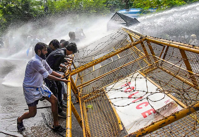 Police use water canon against Kerala Students Union (KSU) activists during a protest in front of the Ernakulam Police Commissioners office, in Kochi on Wednesday.
