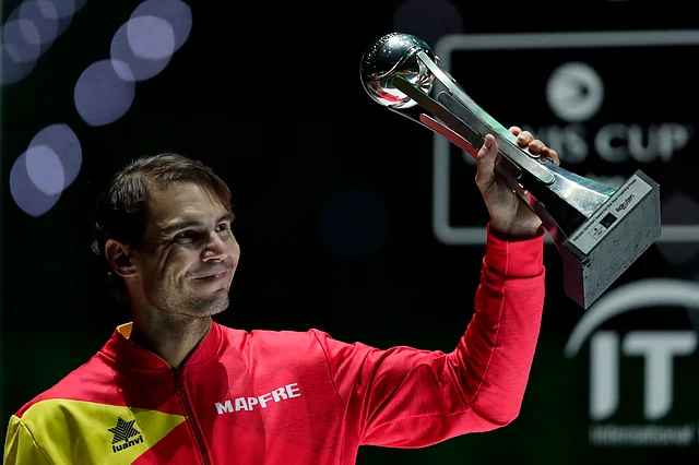 Spain’s Rafael Nadal holds the tournament’s best player award after Spain defeated Canada in the Davis Cup final in Madrid, Spain.