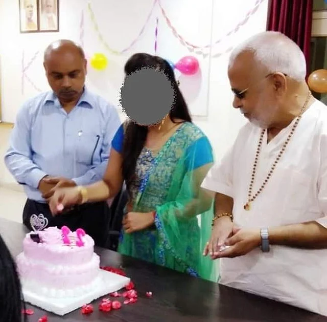 The complainant was photographed during her 22nd birthday celebrations at college. Chinmayanand is to her left and the college principal to her right.
