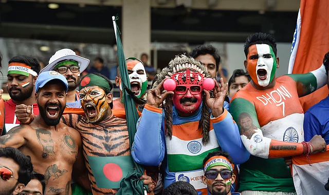 Cricket fans show pink balls during the 1st pink-ball day/night cricket test match between India and Bangladesh in Kolkata on Friday.