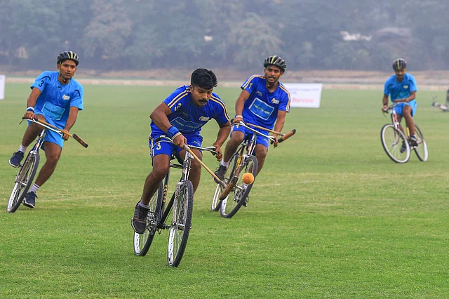 Players of Tyka Warriors (in light blue) and Burari Tuskers (in blue) in action at the semi-final of Cycle Polo League, in Jaipur on Thursday.