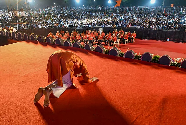 Shiv Sena President Uddhav Thackeray greets his supporters after taking oath as the 18th Chief Minister of Maharashtra, at Shivaji Park in Mumbai on Thursday, 28 November.
