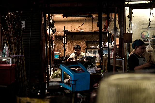 A shopkeeper busy doing his own thing