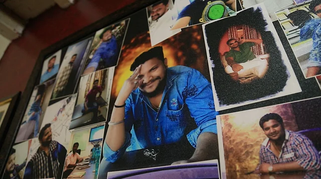 A frame of Kalpesh's photos in the Jadhav house.