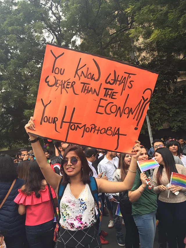 Protesters also raised posters calling out homophobia. 