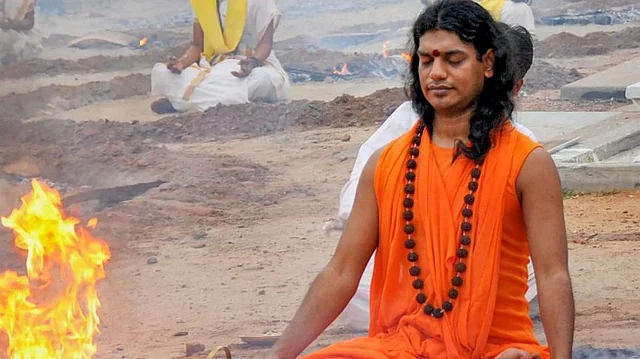 A photo of Nithyananda performing puja at his ashram in Karnataka. 