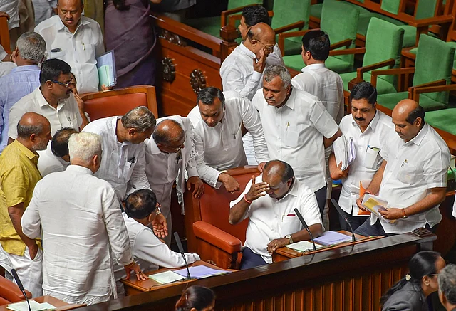 Former Karnataka CM HD Kumaraswamy and his deputy G Parameshwara with other members during the Assembly session at Vidhana Soudha in Bengaluru on 15 July 2019. The Janata Dal Secular-Congress coalition government was to face its trust vote.