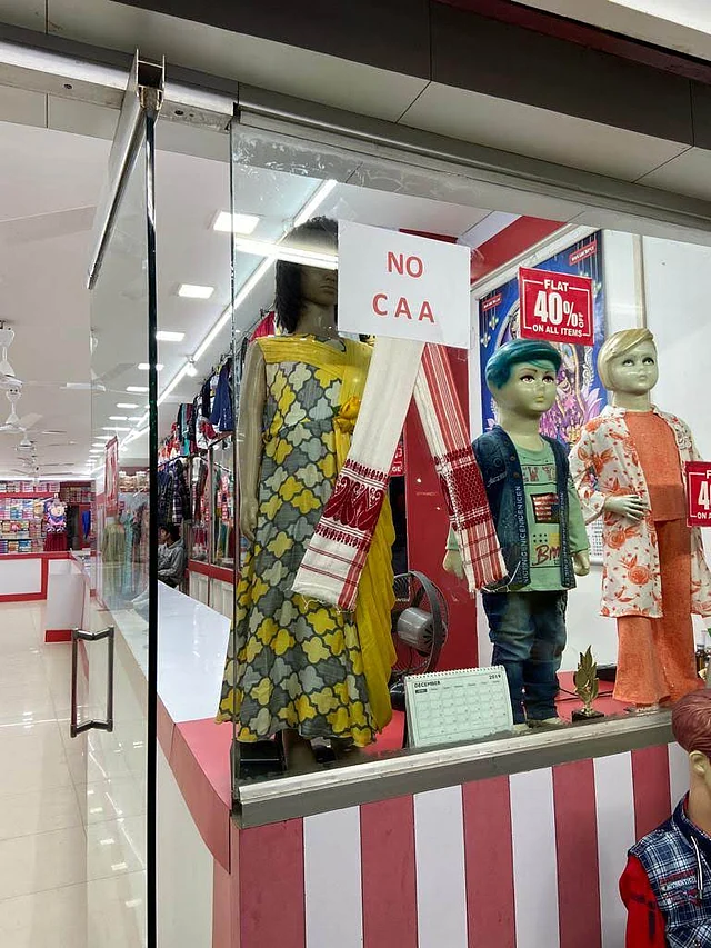 A shop in Assam’s Tezpur with a Gamosa as an anti-CAA banner.