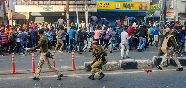Police attempt to disperse protestor in Guwahati on Thursday.