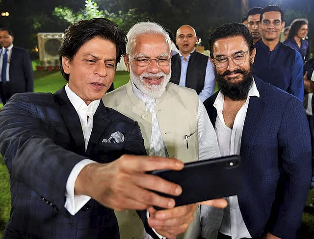 Bollywood superstars Shahrukh Khan and Aamir Khan take a selfie with Prime Minister Narendra Modi at an event to mark Mahatma Gandhis 150th birth anniversary year, in New Delhi, Saturday, 19 October 2019. 