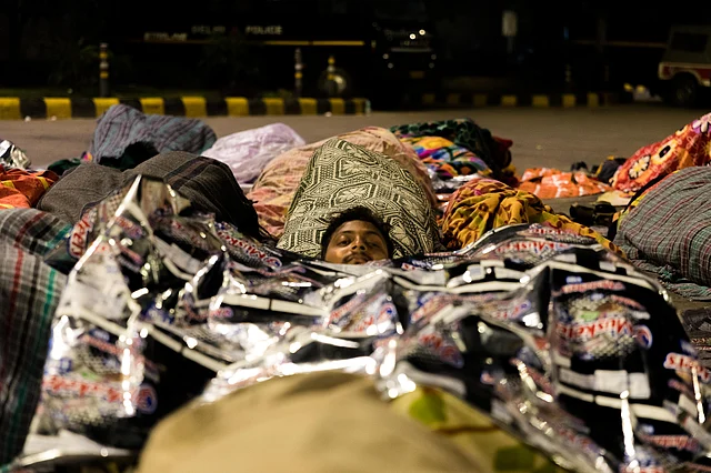 They used plastic to prevent the dew from soaking too far into the blankets.