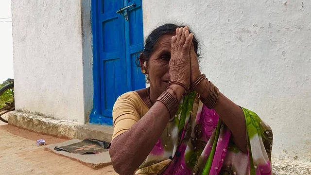 Mohammad’s mother Molanbi, sitting outside their home. 