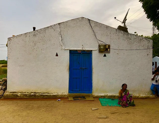 Sitting outside her home, Molanbi is terrified of going inside the house. “Everything reminds me of him,” she says.